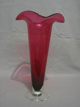 A Victorian style red glass trumpet shaped vase with clear glass base 15"