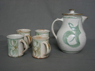 A 5 piece Ursula Wachter coffee set comprising coffee jug and 4 coffee mugs, Alan Cager-Smith an Art Pottery jug 5" (handle f) and a small collection of Swedish glasses