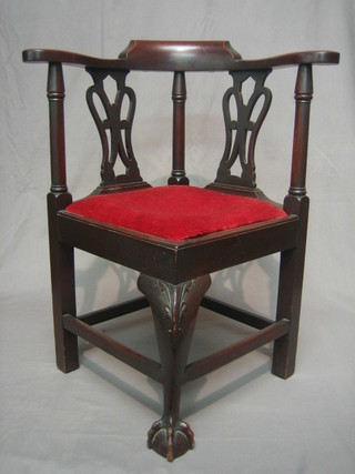A 19th Century childs mahogany corner chair with slat back