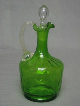 A Victorian green glass ewer with clear glass handle and stopper 8"