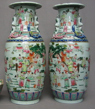 A handsome pair of 19th Century Canton famille vert porcelain vases with dragon handles, the bodies decorated court scenes 22"