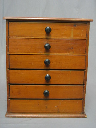 A Victorian pine collector's cabinet of 6 long drawers with tore handles 14"