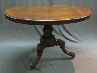 A circular Victorian mahogany Loo table, raised on tripod supports 46"