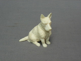 A fine quality carved ivory figure of a seated Terrier 3"