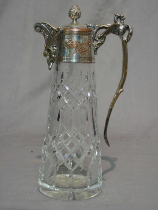 A cut glass claret jug with silver plated collar