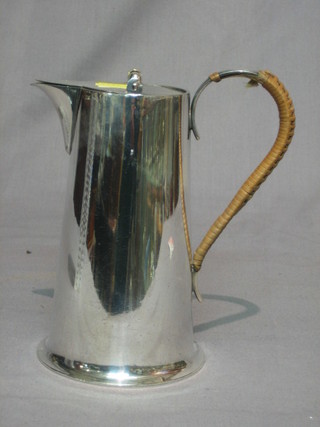 A silver plated hotwater jug