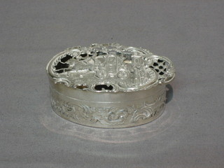 An Edwardian pierced oval silver trinket box with hinged lid decorated a carriage scene, London 1903, 2 ozs