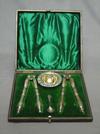 2 pairs of 19th Century nut crackers and a salt and spoon cased