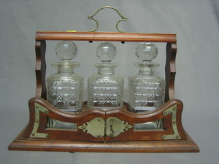 A silver plated and oak 3 bottle tantalus