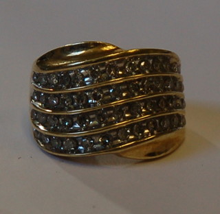 A lady's 10ct gold dress ring set 4 rows of diamonds