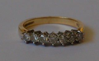 An 18ct gold dress ring set 7 diamonds