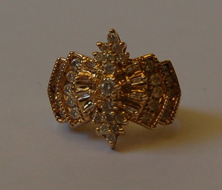 A lady's gold dress ring set numerous diamonds