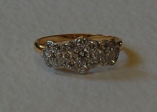A lady's 18ct yellow gold triple cluster dress ring, approx 0.90ct