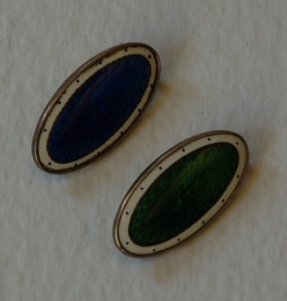 2 oval silver and enamelled brooches