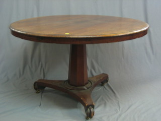 A William IV  circular mahogany snap top Loo table raised on a chamfered column with triform base 46"