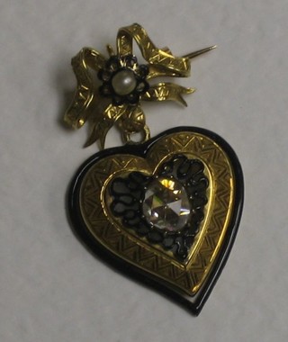 A 19th Century gold heart shaped pendant brooch set a diamond