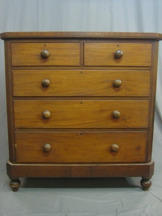 A Victorian mahogany chest of 2 short and 3 long drawers with tore handles, raised on bun feet 48" 