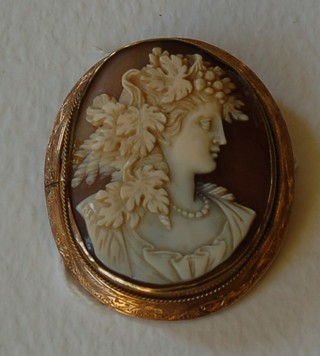 A shell carved cameo portrait of a lady in a gilt metal mount 2"