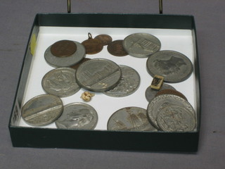 A collection of various commemorative medallions