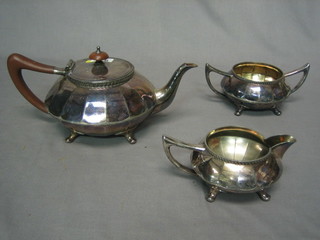 An Art Deco circular Britannia metal 3 piece tea service comprising teapot, twin handled sugar bowl and cream jug