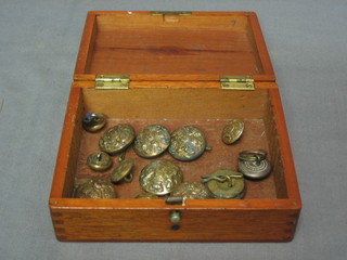A WWI mahogany box containing a collection of various General Service Corps buttons