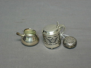 A silver mustard pot, a small silver ladle bowl and a silver plated sovereign case