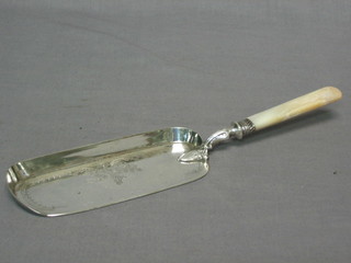 A silver plated crumb scoop with mother of pearl handle