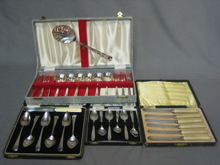 A 12 piece silver plated fruit set, cased, 6 silver plated grapefruit spoons cased, 6 tea knives and 6 silver plated tea spoons, all cased