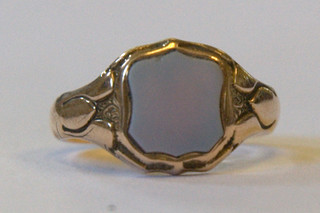 A 15ct gold signet ring set a blue hardstone shield