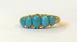 A 22ct gold ring set an oval cut turquoise