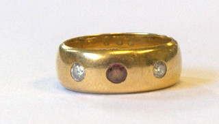 A 22ct gold wedding band set a pink stone and 2 diamonds