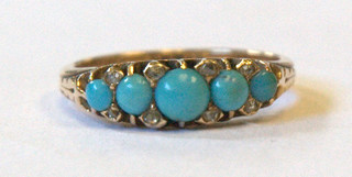 A gold dress ring set 5 turquoise supported by diamonds