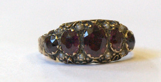 A Victorian 9ct gold dress ring set 5 oval cut amethysts surrounded by demi-pearls