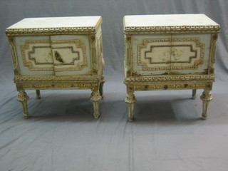 A pair of French style painted bedside cabinets enclosed by panelled doors, raised on turned supports 22"
