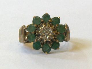 A 9ct gold barked dress ring set green and white stones