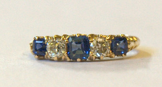 A lady's 18ct yellow gold dress ring set 3 sapphires and 2 diamonds