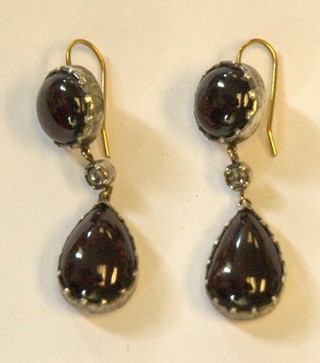 A pair of cabouchon garnet and diamond set drop earrings