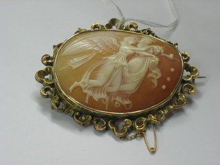 A shell carved cameo brooch contained in an oval gilt metal mount