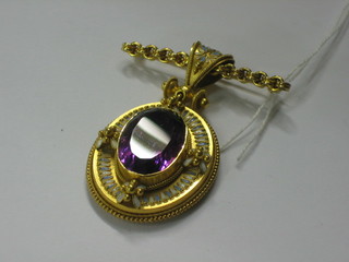 An oval cut amethyst pendant contained in a gilt metal mount, mounted as a brooch