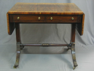A Victorian rosewood sofa table with a crossbanded top, fitted 2 drawers, raised on splayed supports 33"