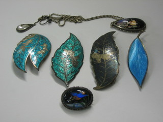 A silver butterfly winged pendant, do. brooch and 4 Eastern enamel and silver brooches