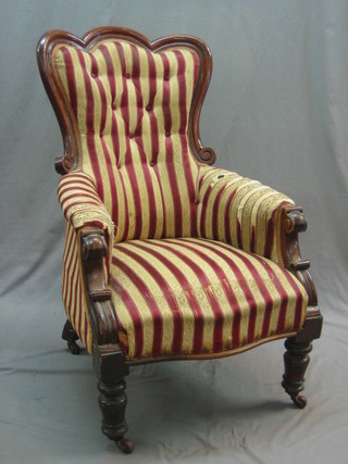 A William IV mahogany show frame armchair upholstered in Regency striped material and raised on turned supports