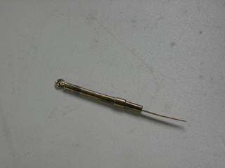 A gold tooth pick