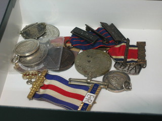 A silver ARP badge (f), a British War medal an LCC School attendance medal, a silver and enamelled Buffaloes jewel, a George V Unofficial Coronation medal, a small bronze medal, a silver Edward VII Coronation medallion, a brooch set a Georgian silver shilling and 2 silver watch chain medallions