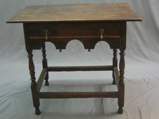 A 17th/18th Century oak low boy fitted a drawer and raised on turned and block supports united by a box framed stretcher, 32"