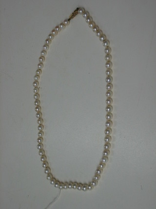 A rope of 65 cultured pearls with 9ct gold clasp