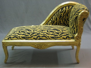 A "childs" reproduction Victorian style carved giltwood show frame chaise longue 36"