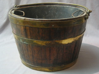 A circular coopered oak coal bin with brass swing handle 14"