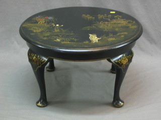 A 1930's circular black lacquered chinoiserie style coffee table raised on cabriole supports 23"