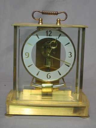 A 1950's West German battery operated mantel clock by Kieninger, contained in a gilt metal case 8"